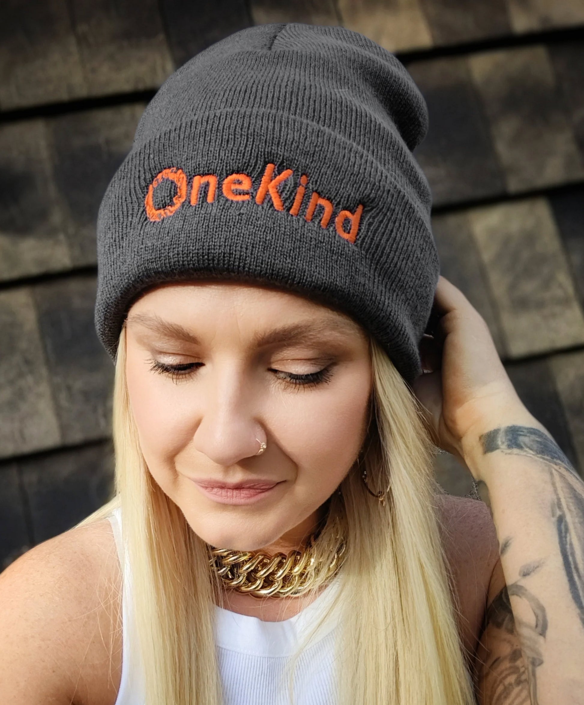 Grey beanie hat with orange OneKind logo